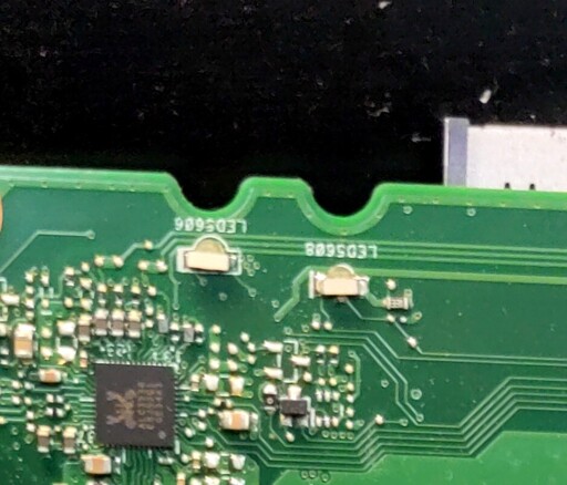 close-up of a pair of LED lights mounted on the edge of a circuit board